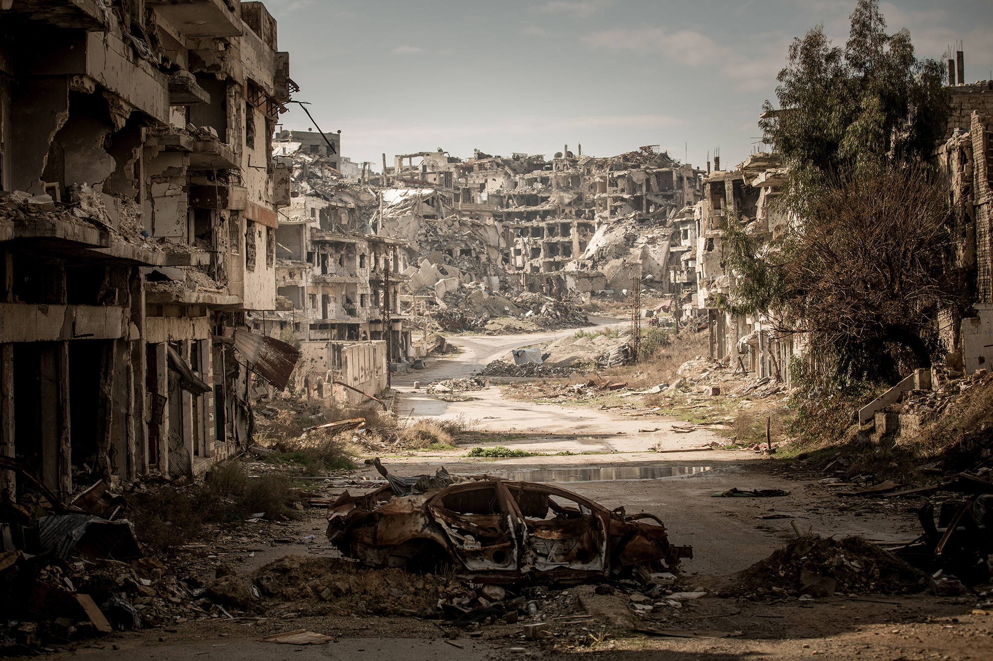 Улицы разрушенного города. Хомс Сирия. Сирия руины. Разрушенный город. Развалины города.