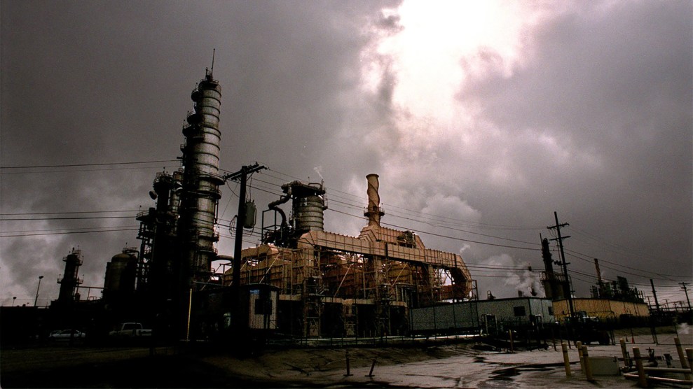 A refinery under dark cloudy skies