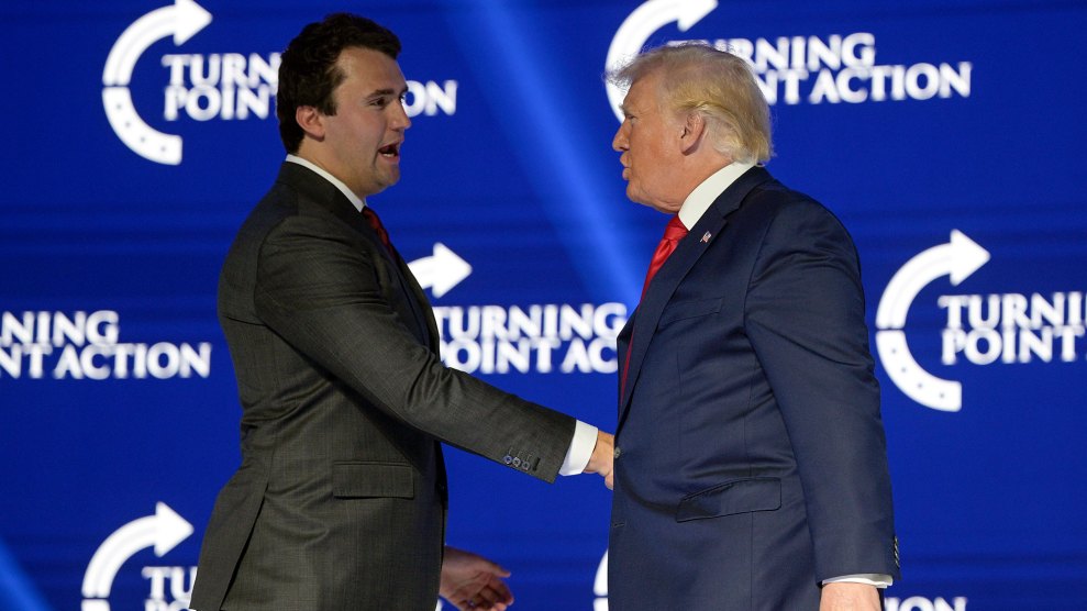 Donald Trump shakes hands with Charlie Kirk