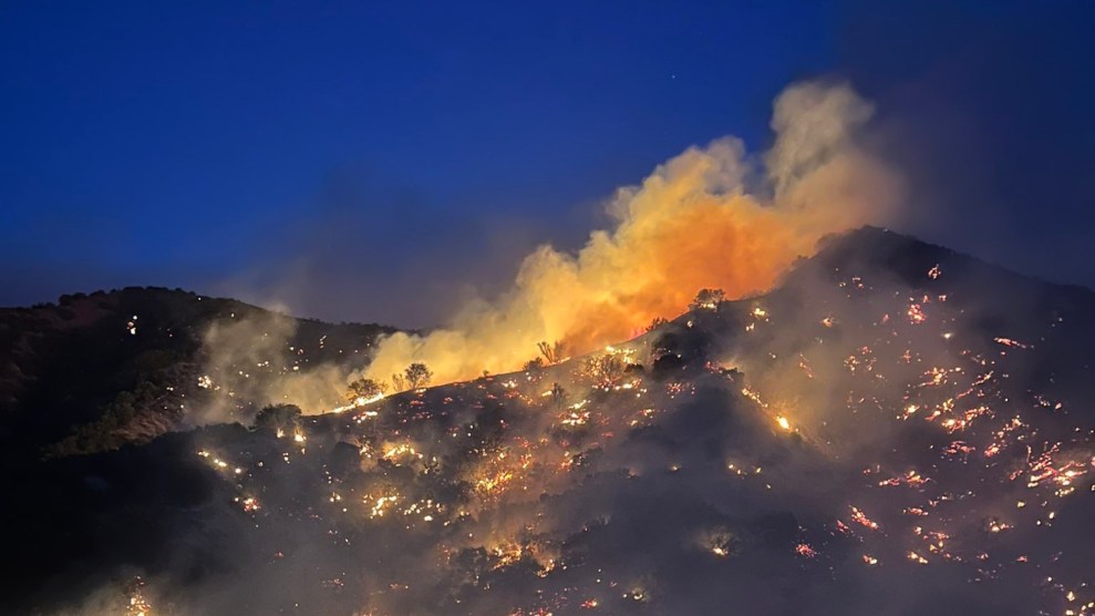 A bright orange wildfire burns in Ventura County, California at night.