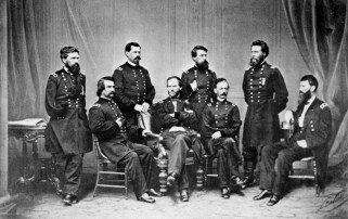 Black and white photo of Civil War officers sitting and standing in a group portrait.