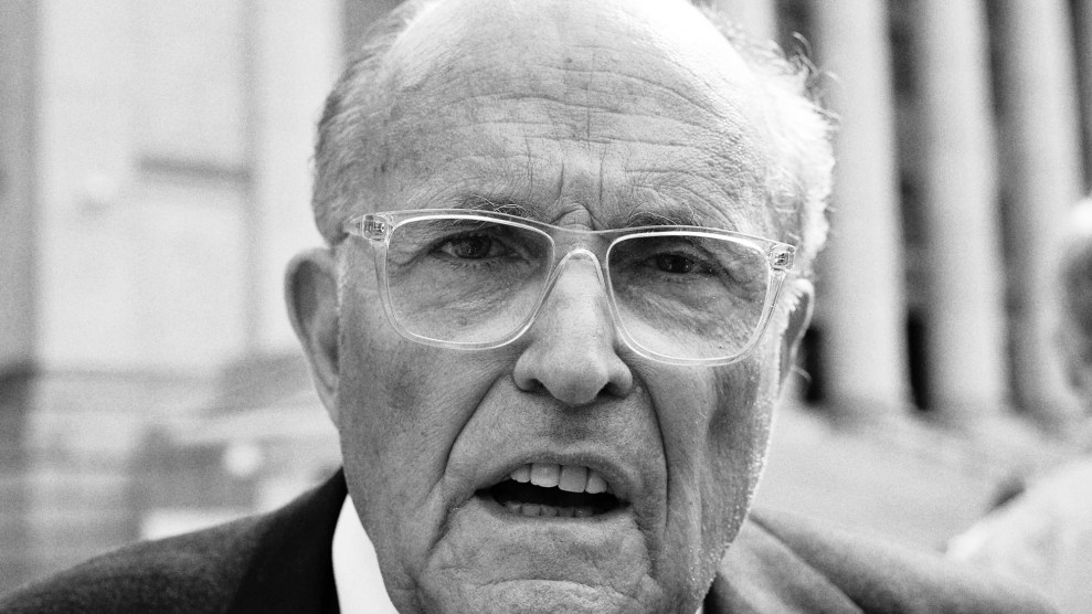 Black and white close-up photo of Rudy Giuliani with his mouth open.