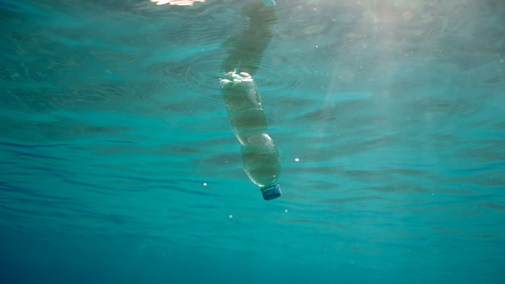 A plastic bottle floats in the sea