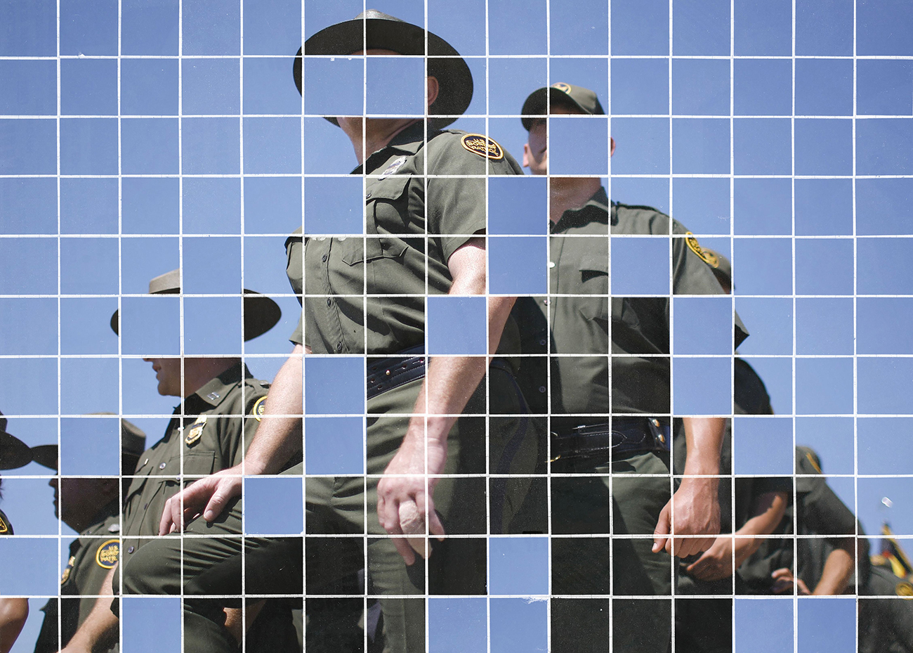 A pixelated image of border patrol officers.