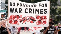 "No funding for war crimes" banner