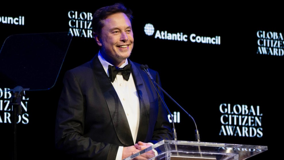 Elon Musk stands on a podium at the Global Citizen Awards.