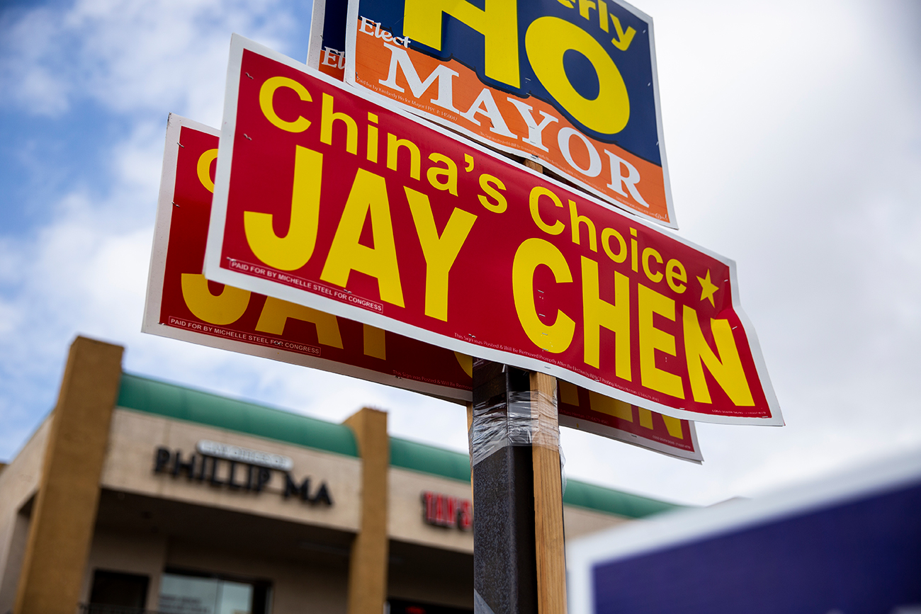 A sign reading "China's Choice, Jay Chen"