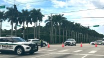 Palm Beach County Sheriff's vehicles block off a road