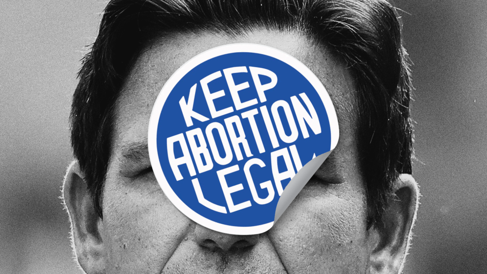 A closely cropped image of Ron DeSantis's face from his upper lip to his hair. A partially peeled sticker that reads 'Keep Abortion Legal' is pasted over him.