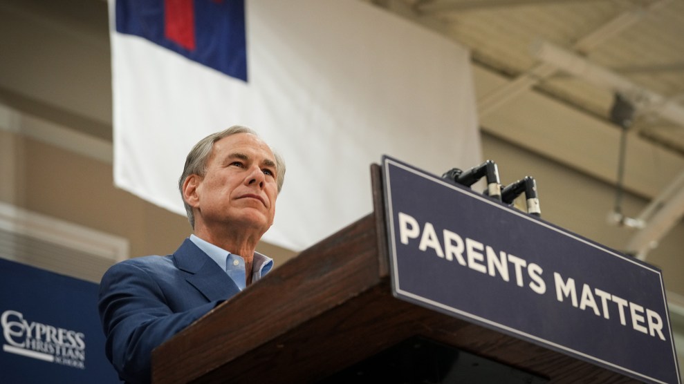 Greg Abbott stands at a podium with a sign that reads: "Parents matter."