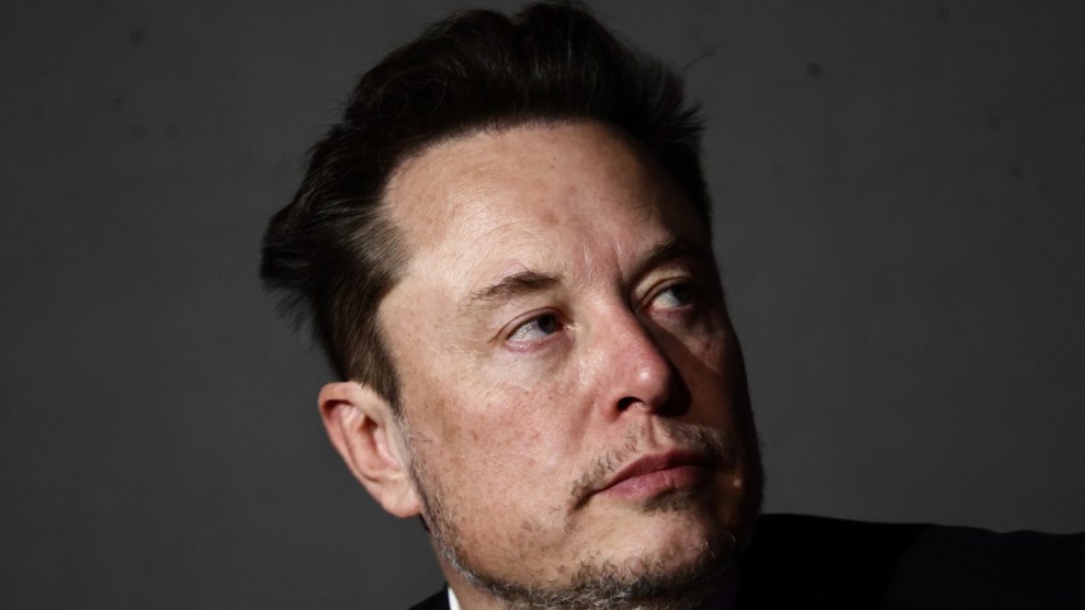 Elon Musk's head in frame while facing to the right.