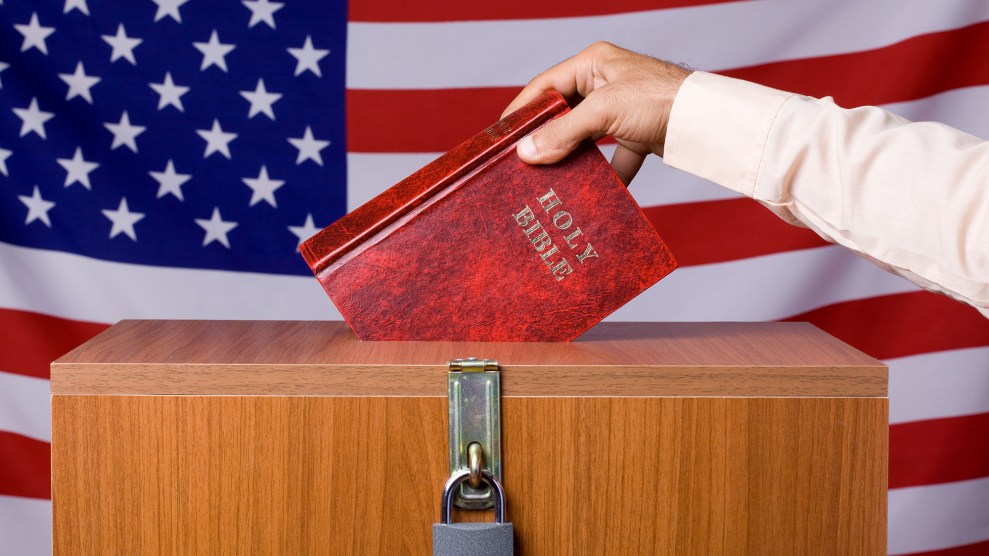 Human Hand Inserting Bible To Ballot Box Before American Flag