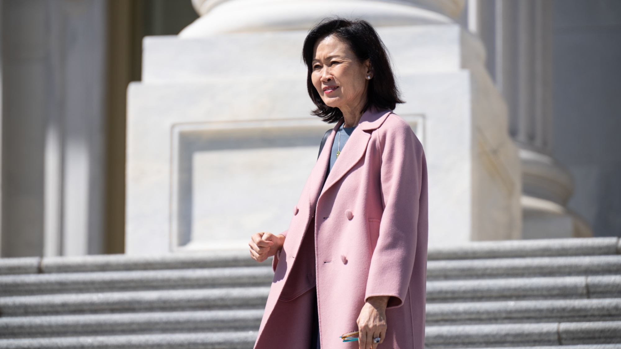 Rep. Michelle Steel walks outside down the House steps. 