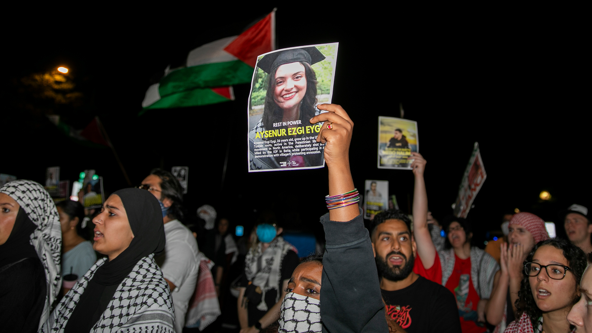 A person holds an image of Turkish-American human rights activist Aysenur Ezgi Eygi during a pro-Palestinian rally.