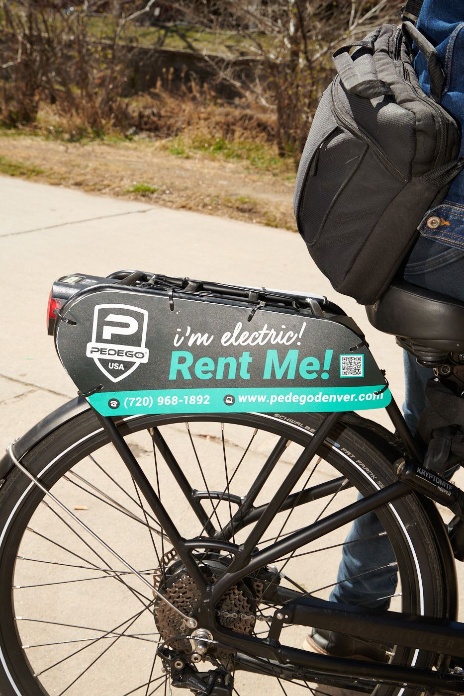 Back of bicycle with small sign that reads, "Rent Me!"