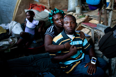 Daniel, who is trying to launch a relief group from his plastic hovel, with his fiancée and 10-year old daughter Melissa.