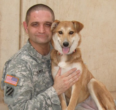 Reunited: With the help of Operation
Baghdad Pups, Staff Sgt. Luke Henry, a mental-health specialist, was
able to bring home his adopted Iraqi dog, Band-Aid. / Courtesy of
Operation Baghdad Pups