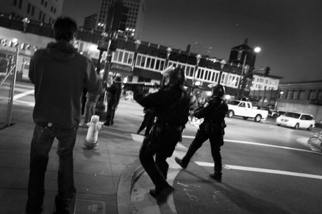 Police respond to protesters breaking out of the blockade.