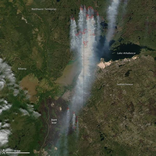 Thick smoke from drought- and heat-ravaged Canada streams south towards US. Wildfires outlined in red. Credit: Jeff Schmaltz, MODIS Rapid Response Team at NASA GSFC.