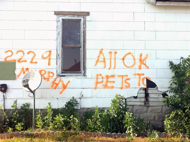 Residents spray-painted their homes with news of the living and deceased.