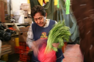 Buying celery fro the broth at the market. 