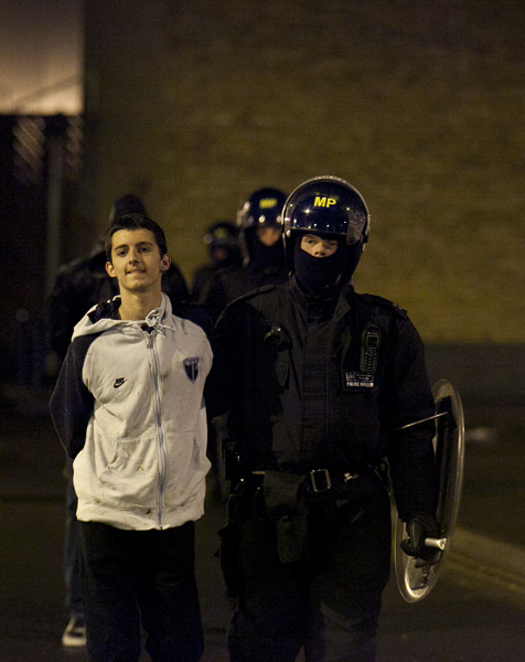 Police arrest a young looter in Bixton, London.: Matt Cetti-Roberts/ZUMA