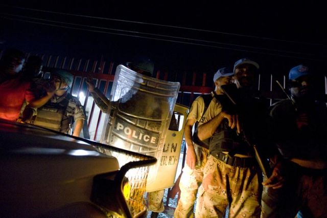 UN and local police guard the the Port Au Prince airport upon Baby Doc's return to Haiti.