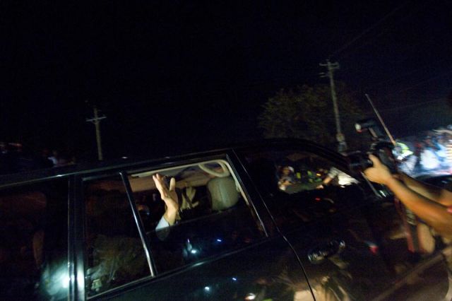 Baby Doc waves to supporters upon his arrival in Port Au Prince