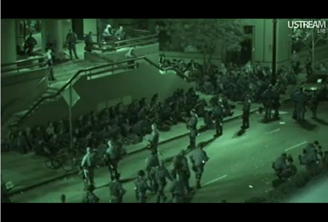 Police round up Occupy Oakland protesters outside a downtown YMCA.: Spencer Mills (@OakFoSho)