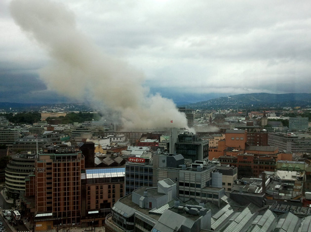 OSLO, NORWAY - Smoke billows from central Oslo Friday after two explosions blasted buildings including the prime minister's office.: Scanpix/Zuma