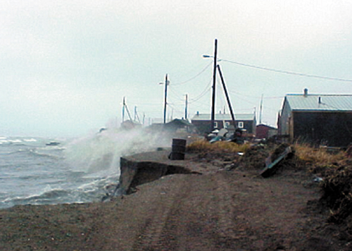 Shishmaref village, Alaska, inhabited for 400 years, battered by storm waves.: Credit: NOAA.