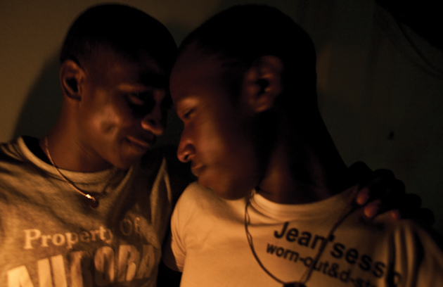 A couple at a gay bar in Kampala that recently opened.: Photographs by Bryan Anselm