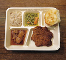 Who decides what goes into school lunches?